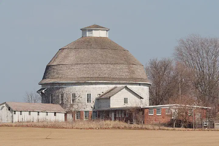 The University of Illinois Experimental Dairy Farm Historic District in Urbana, with a cow shed and Barn No. 3, built in 1912.