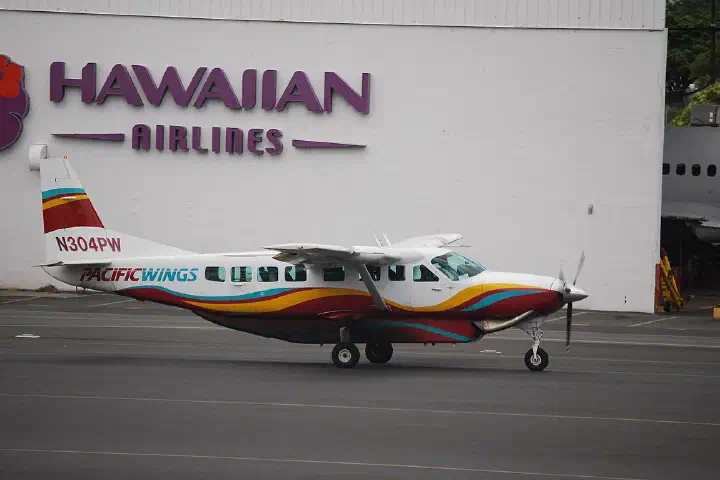 A Pacific Wings Caravan heads for the gate.