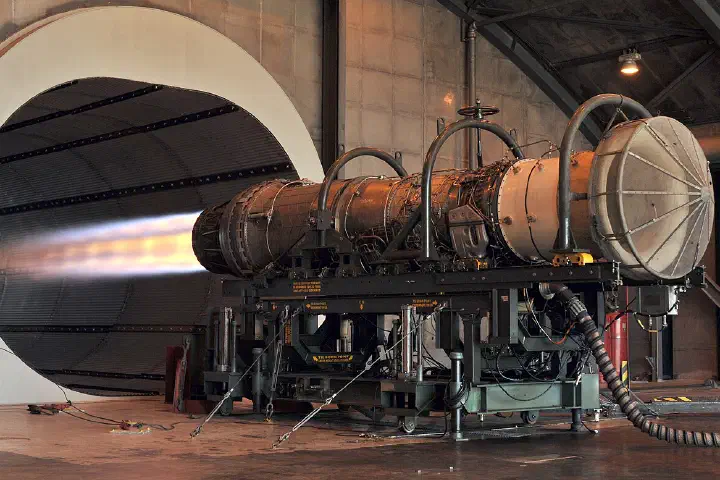 An afterburner glows on an F-15 Eagle engine during a test run after a repair, November 10, 2010.