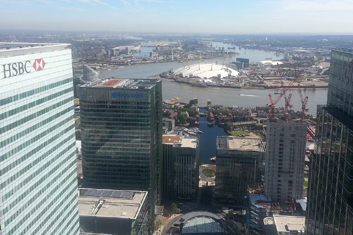 The O2 arena between the HSBC, Canary Wharf, Barclays and Citi buildings, London.