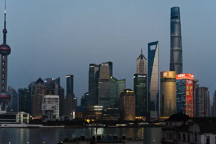 The skyline of Pudong at dusk.