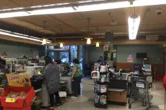 Self-checkouts at the back entrance of a store.
