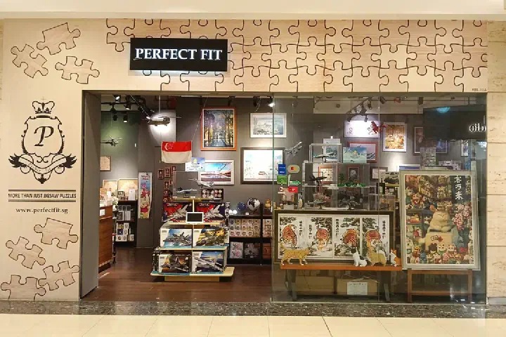 A gift store at CityLink Mall selling puzzles and Cobi sets.