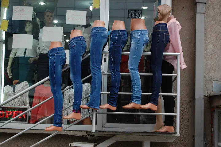 Denim jeans on mannequin legs, outside a clothes shop on Agim Ramadani Street, Pristina, Kosovo.