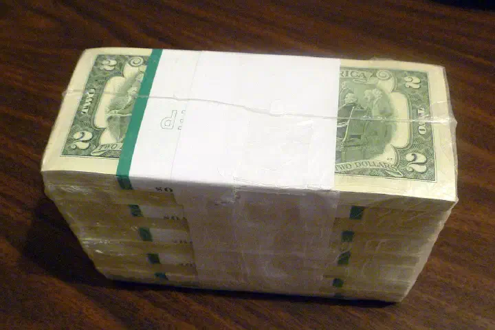 A thousand U.S. two-dollar bills in shrink wrap.