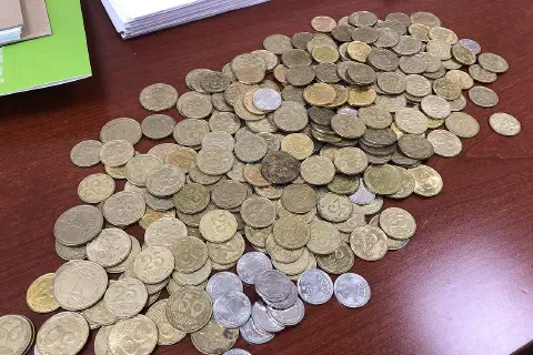 A pile of Ukrainian currency coins.