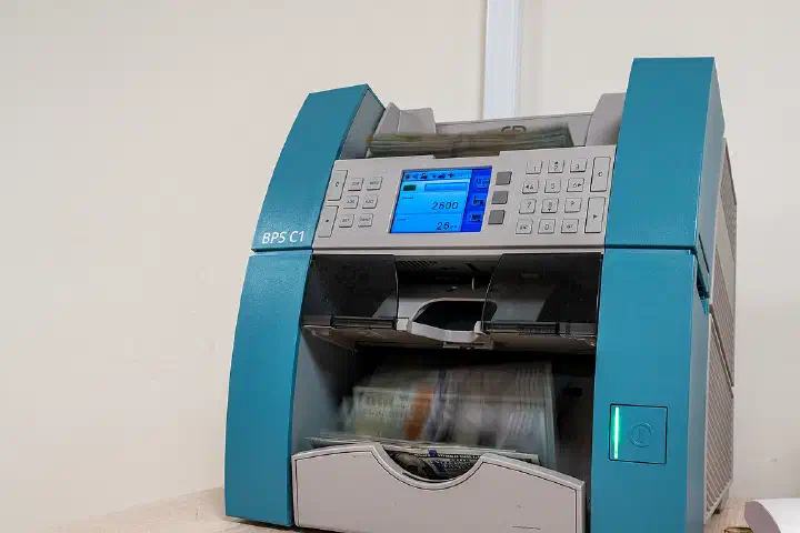 A money counting machine in use at an undisclosed location in the U.S. Central Command area, Jan. 12, 2024.