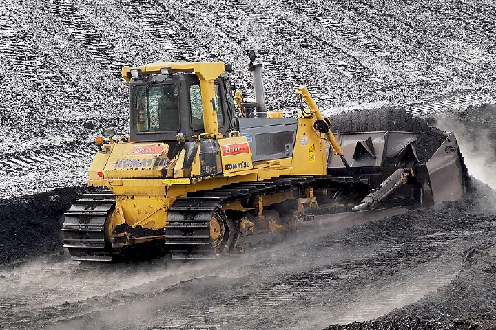 A Komatsu bulldozer pushing Indonesian coal at a power plant in Ljubljana.