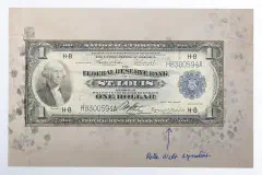 A currency certificate from the Federal Reserve Bank, signed by Rolla Wells.