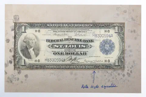 A currency certificate from the Federal Reserve Bank, signed by Rolla Wells.
