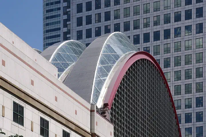 The roof of Canary Wharf DLR station with 1 Canada Square in the background.