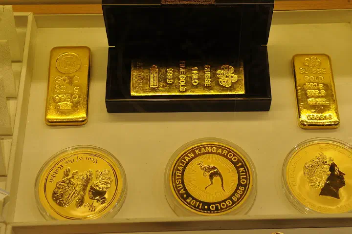 Gold coins and gold bars.
