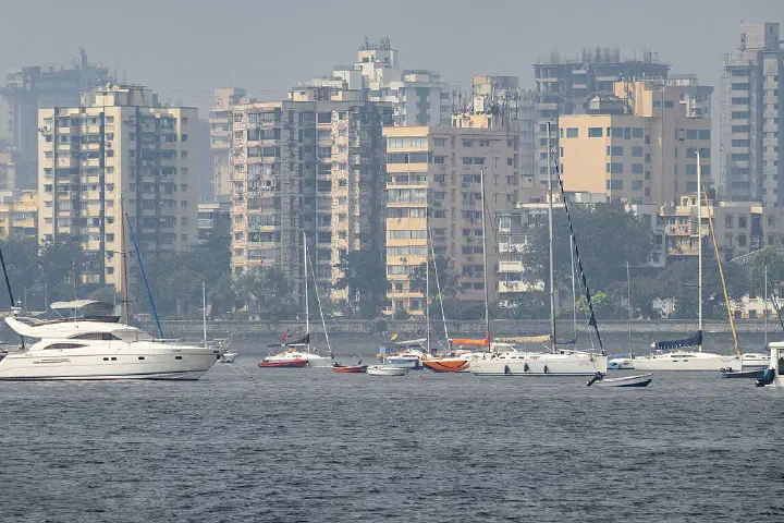 The Mumbai skyline with sailboats.