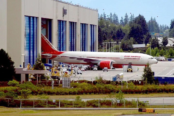A Boeing 777 is rolled out at the Boeing factory.