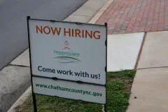 A 'Now Hiring' sign in Pittsboro, North Carolina