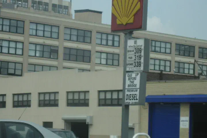 A sign showing gas prices.