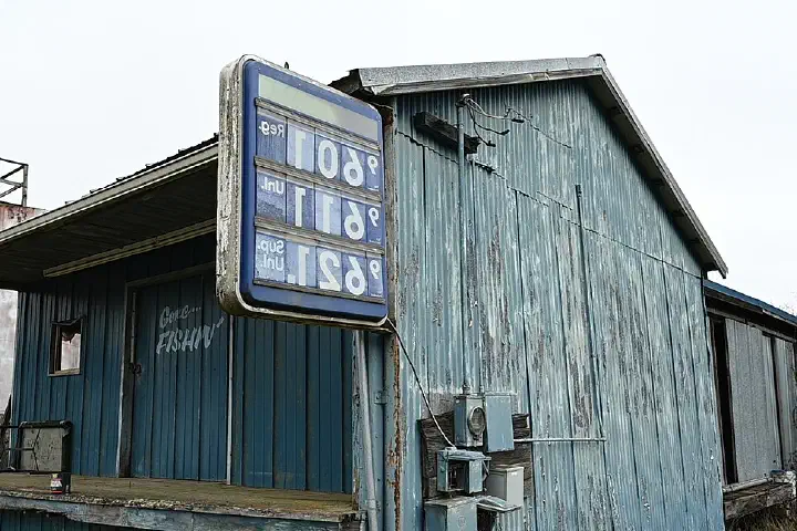 A gas station with a price sign.