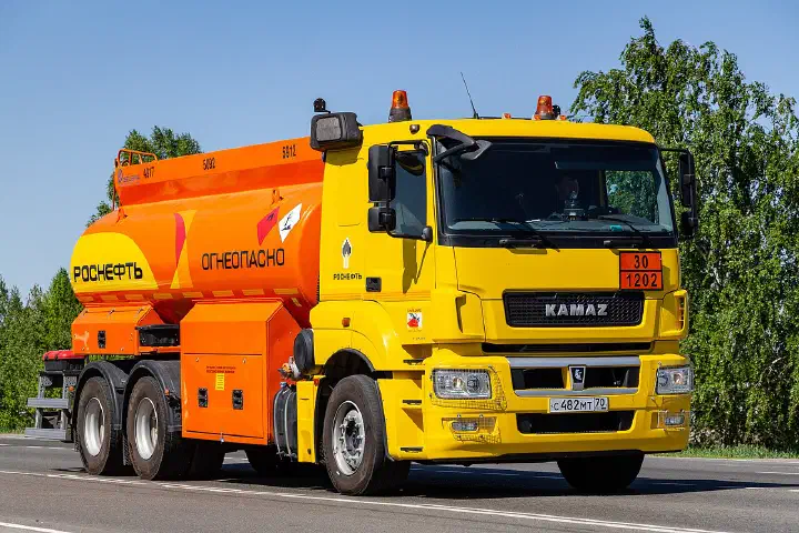 A fuel tank truck on a KAMAZ-65207 chassis in Tomsk, Russia.