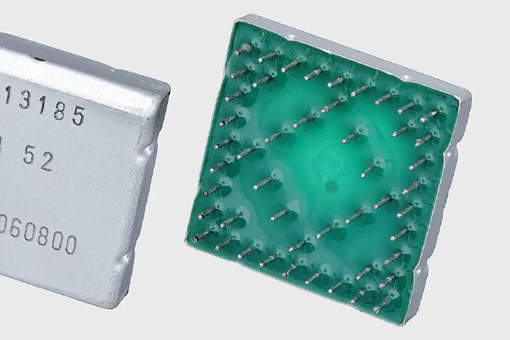 An IBM MST module, which packaged integrated circuits on a ceramic wafer in a square metal can.