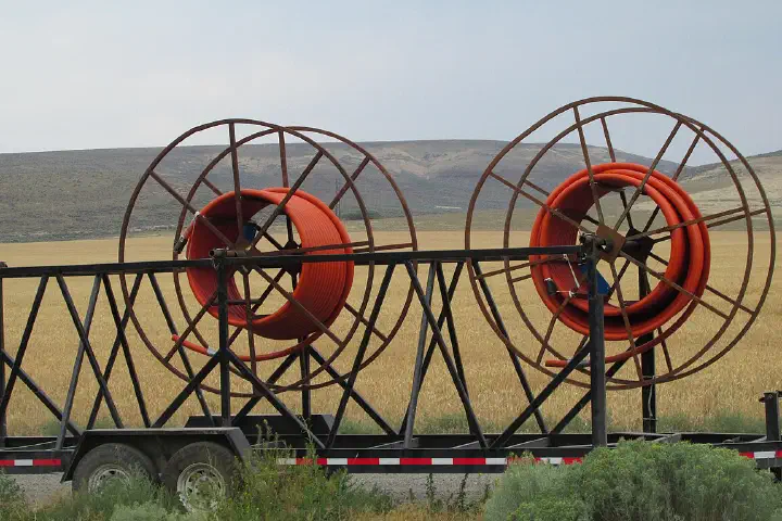 Laying fiber-optic cable along a stretch of highway between Yakima and the Vernita Bridge.