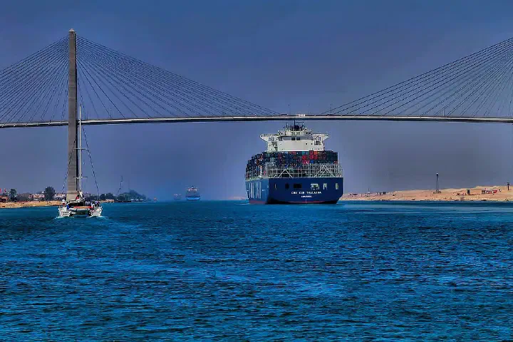 Container ship CMA CGM Thalassa passing the Suez Canal Bridge
