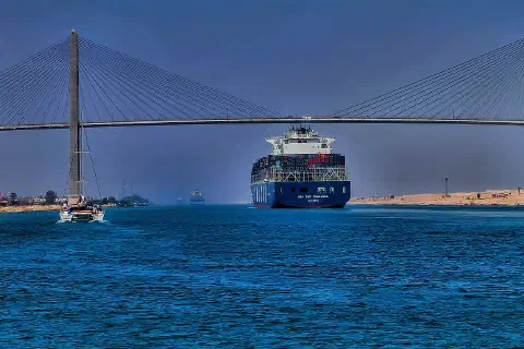 Container ship CMA CGM Thalassa passing the Suez Canal Bridge