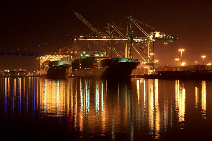 Evergreen container ships under giant cranes at the Port of Los Angeles, California.