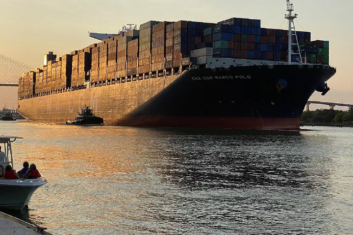 The CMA CGM Marco Polo passes through the Port of Savannah, Georgia, at sunset.