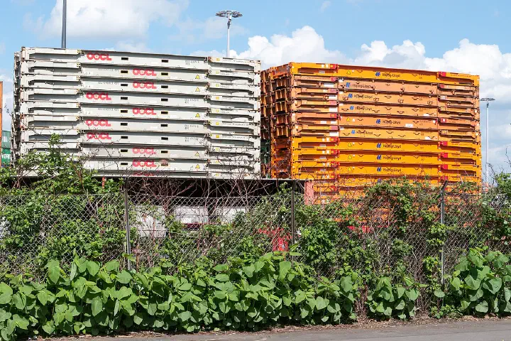 Flatrack containers stacked near the Burchardkai container terminal in the Port of Hamburg.