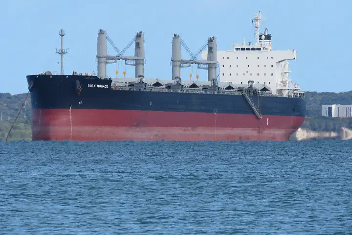 The bulk carrier Bulk Monaco in Cockburn Sound, Western Australia, seen from near the CGH Grain Jetty, with Garden Island in the background.