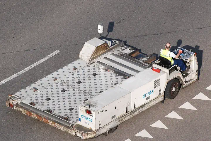 A vehicle for handling aircraft containers at Zurich Airport.
