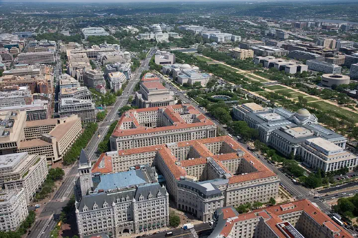 An aerial view of Pennsylvania Avenue (left) and the Federal Triangle (center), facing east toward the U.S. Capitol in Washington.