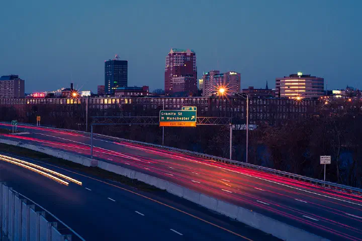 The Manchester skyline at night, viewed from I-293.
