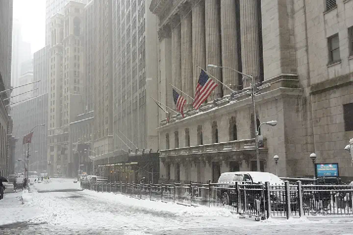 Broad Street at Wall Street, in front of the New York Stock Exchange, during a snowstorm on February 9, 2017.